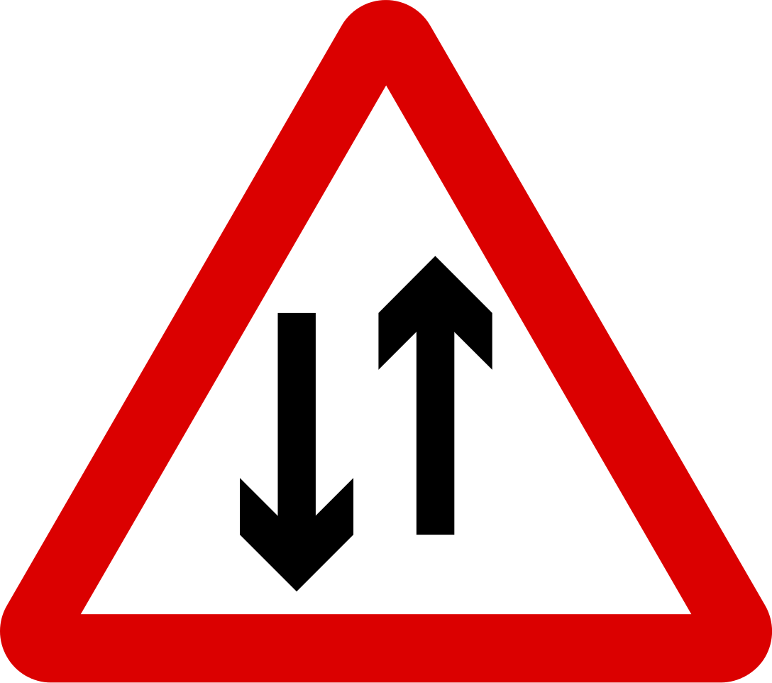 Traffic drives on the opposite direction ahead (Keep right and let incoming traffic pass on the left)